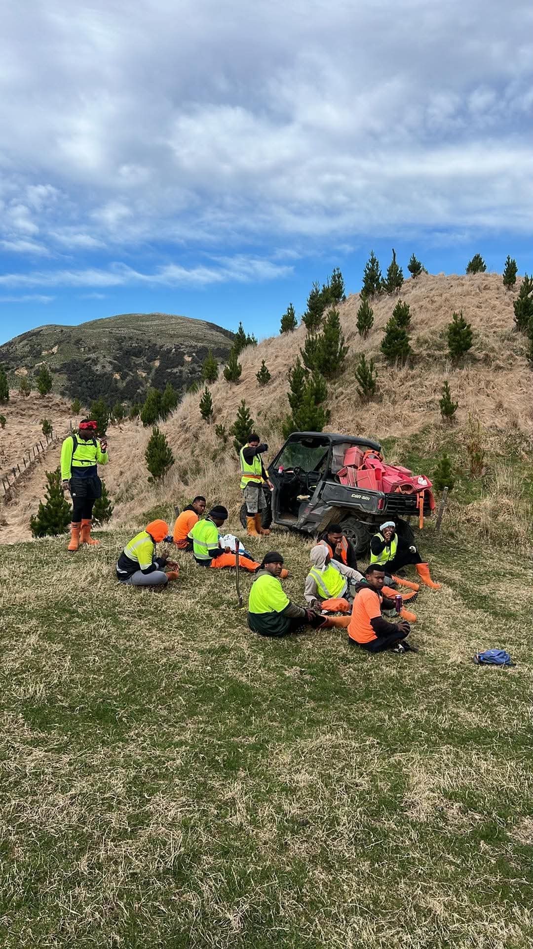 Crew and gear on a hilltop