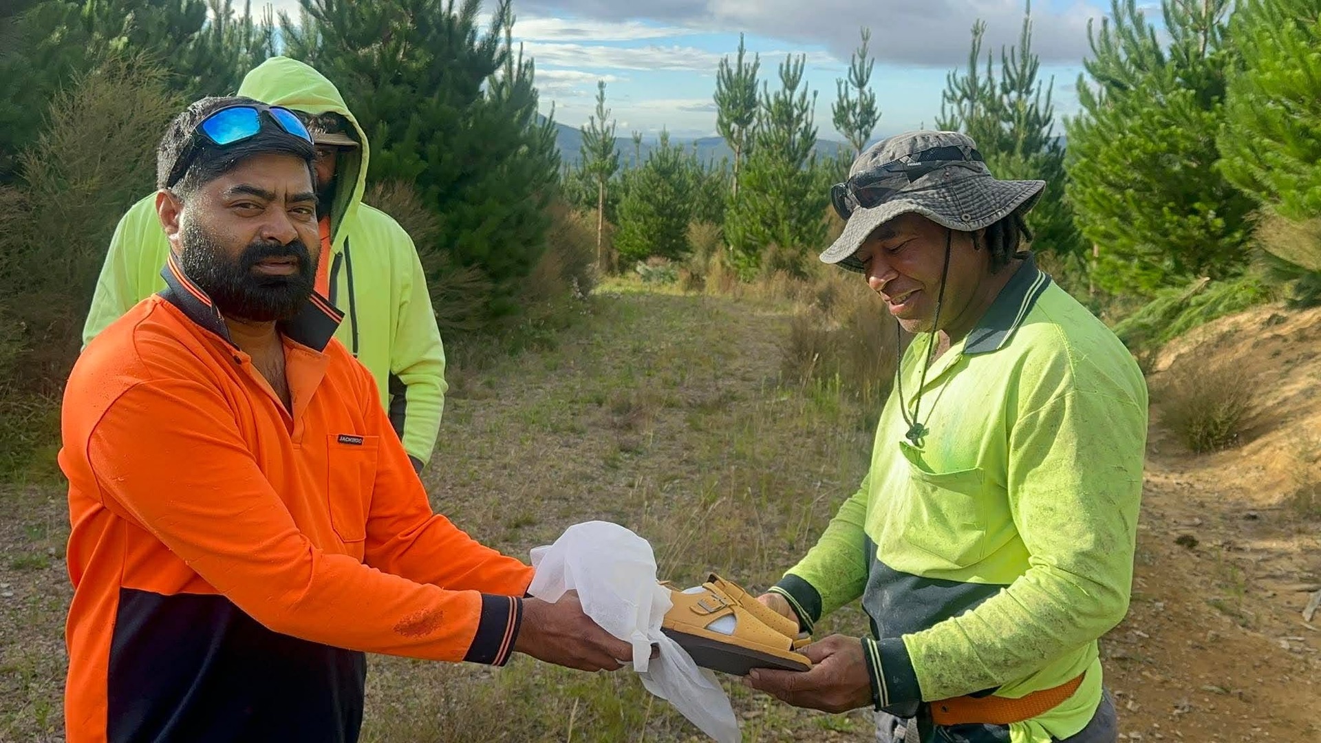 Gear being handed over to a crew member on a block